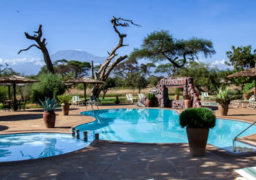 Kibo Safari Camp swimming Pool with Mount Kilimanjaro in the background